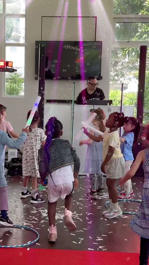 Kids packed onto the dance floor with confetti