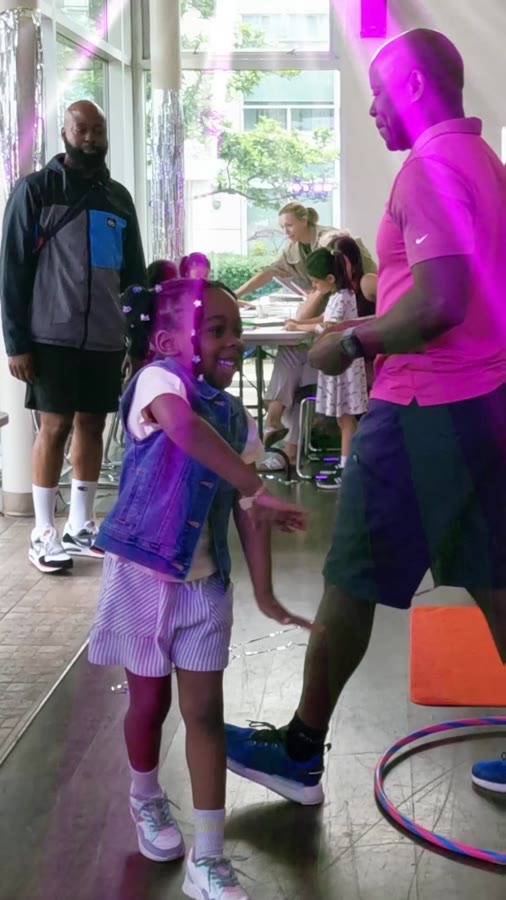 High-energy host dancing with the kids
